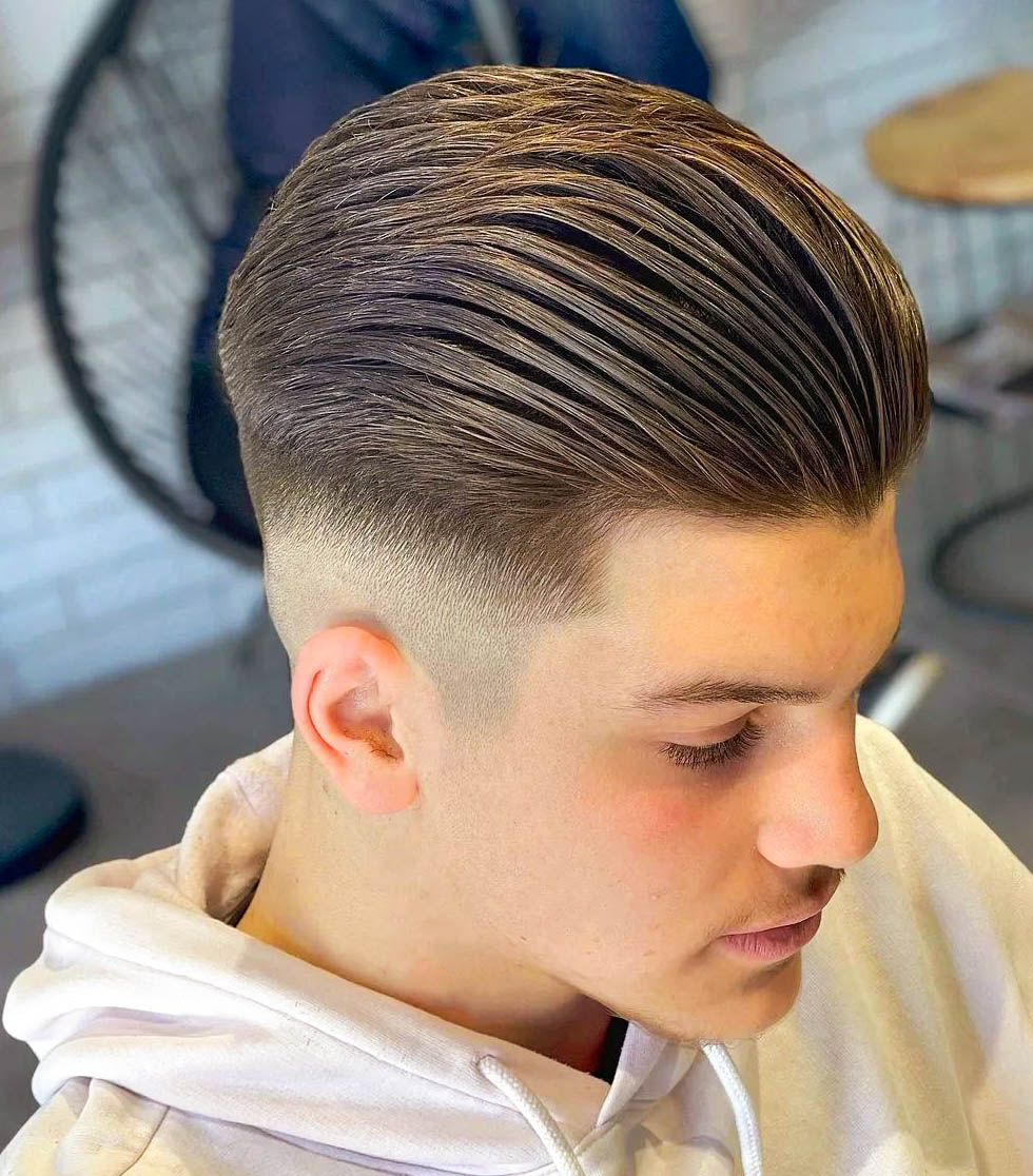 Neat Slick Back with A Mid Skin Fade 
