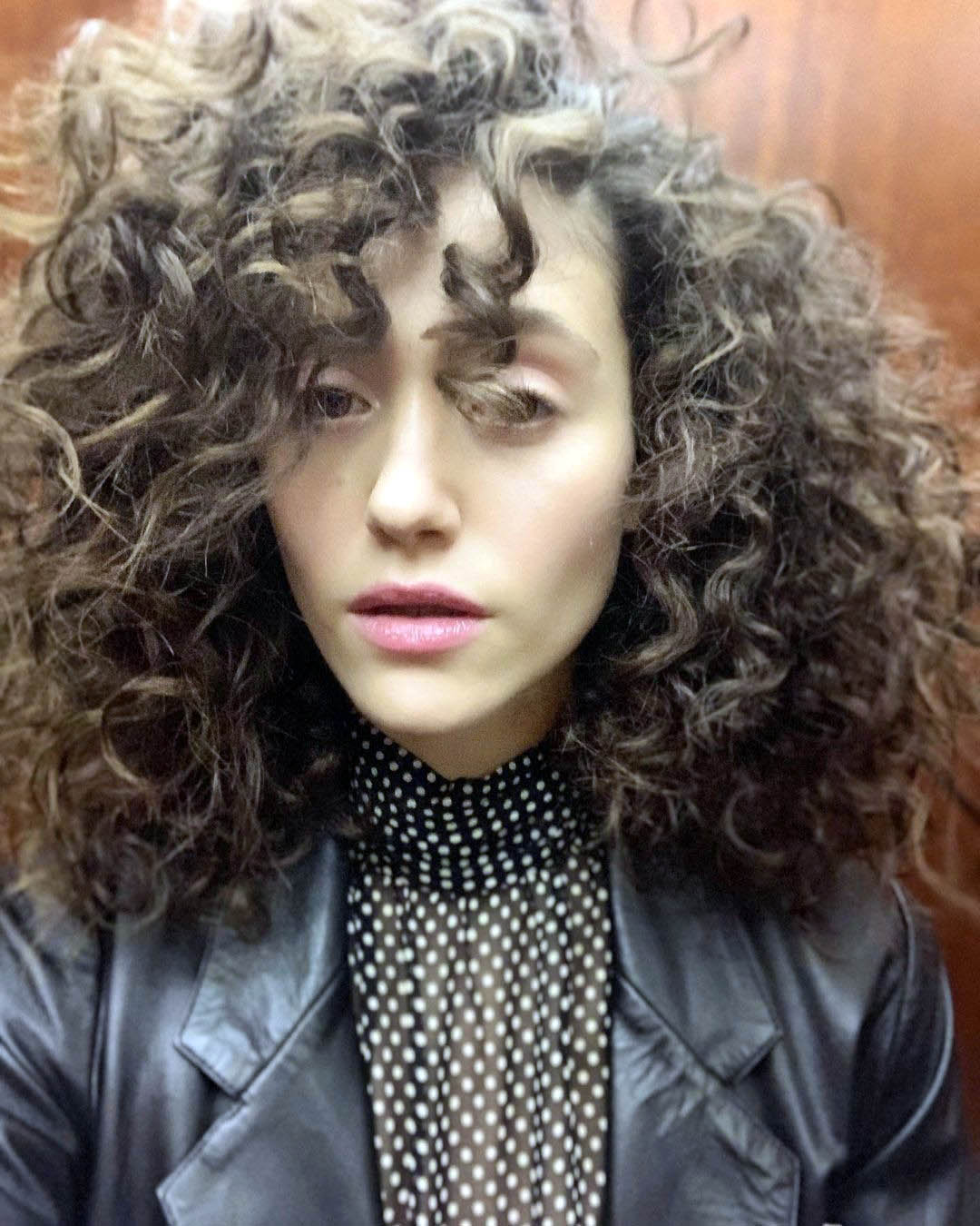 Emmy Rossum's Voluminous Curls With Side Bangs