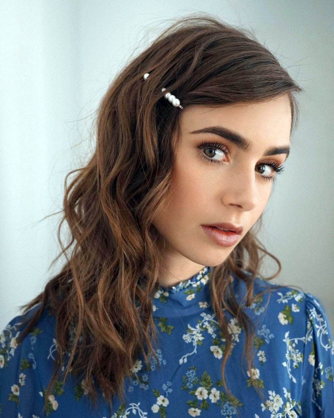 Lily Collins' Pinned Side Bangs