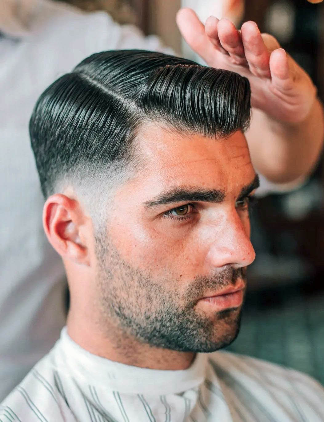 Triangular Front Quiff with Side Part and Low Fade