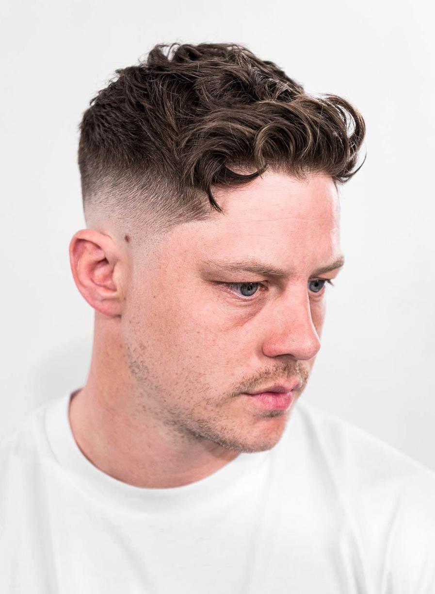 High Taper Fade with Curly Brushed Up Fringe