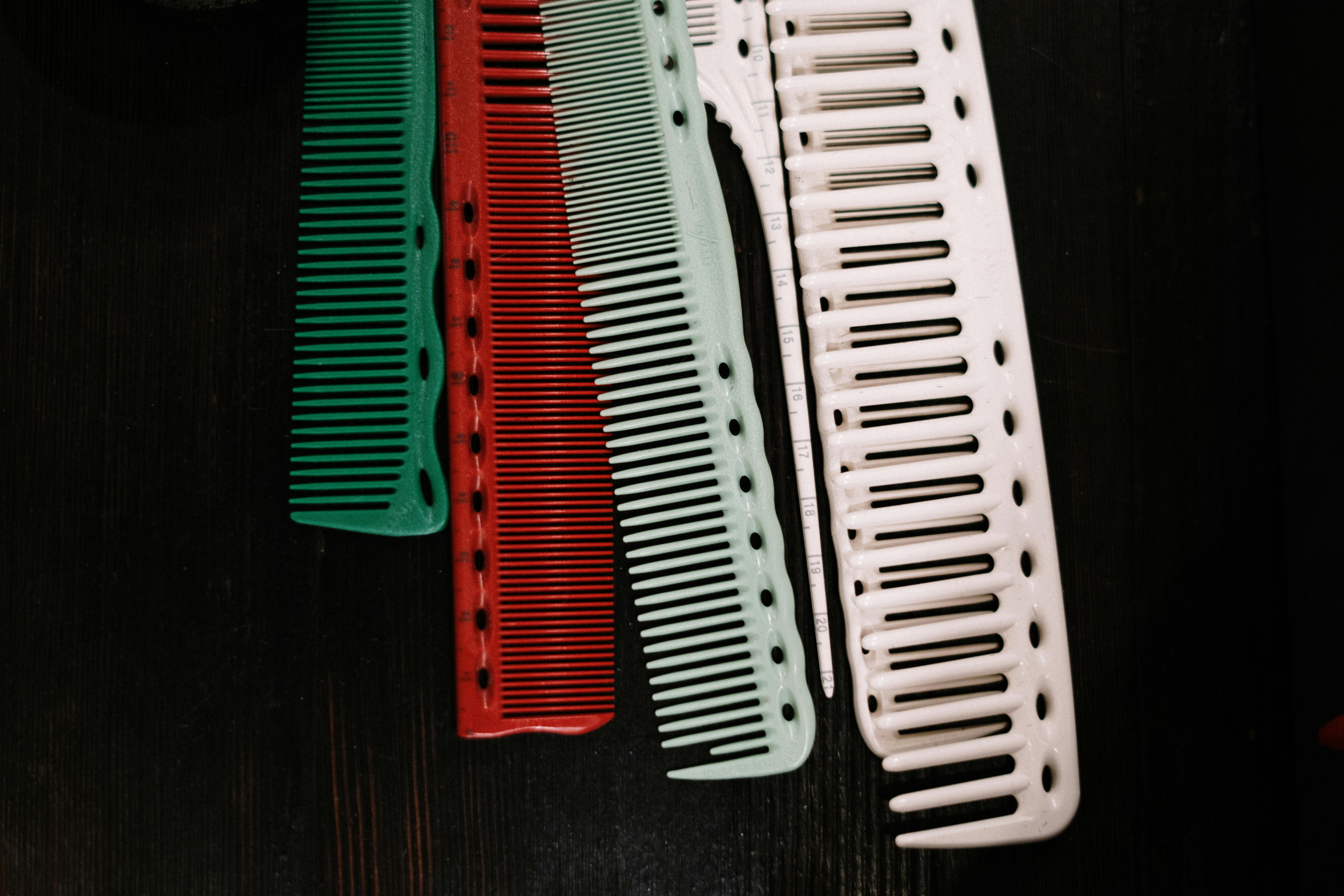 Different combs in different colors for a better hair care routine.