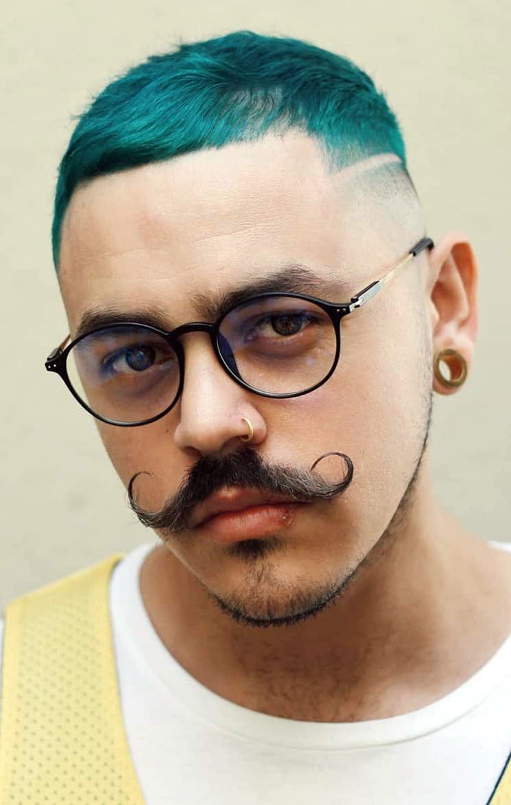 Handsome Stylish Young Man with Artificially Colored Blue Dyed Hair  Undercut Hairstyle Beard and Piercings with Copy Space Stock Photo  Image  of fashionable hispanic 75968118