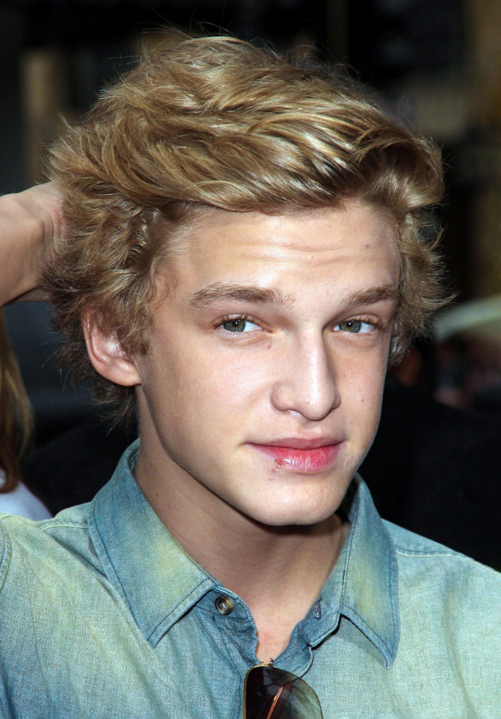 Cody Simpson blonde wavy shag brushed up and back