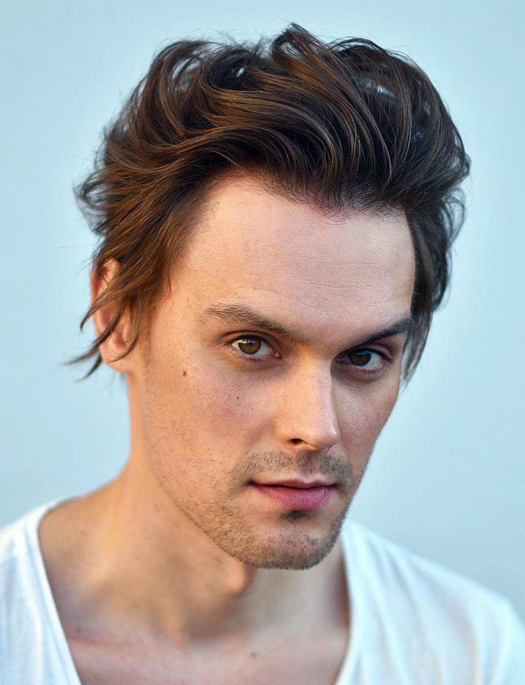 Flowy Wavy Blowout Hairstyle For Guys with Big Foreheads