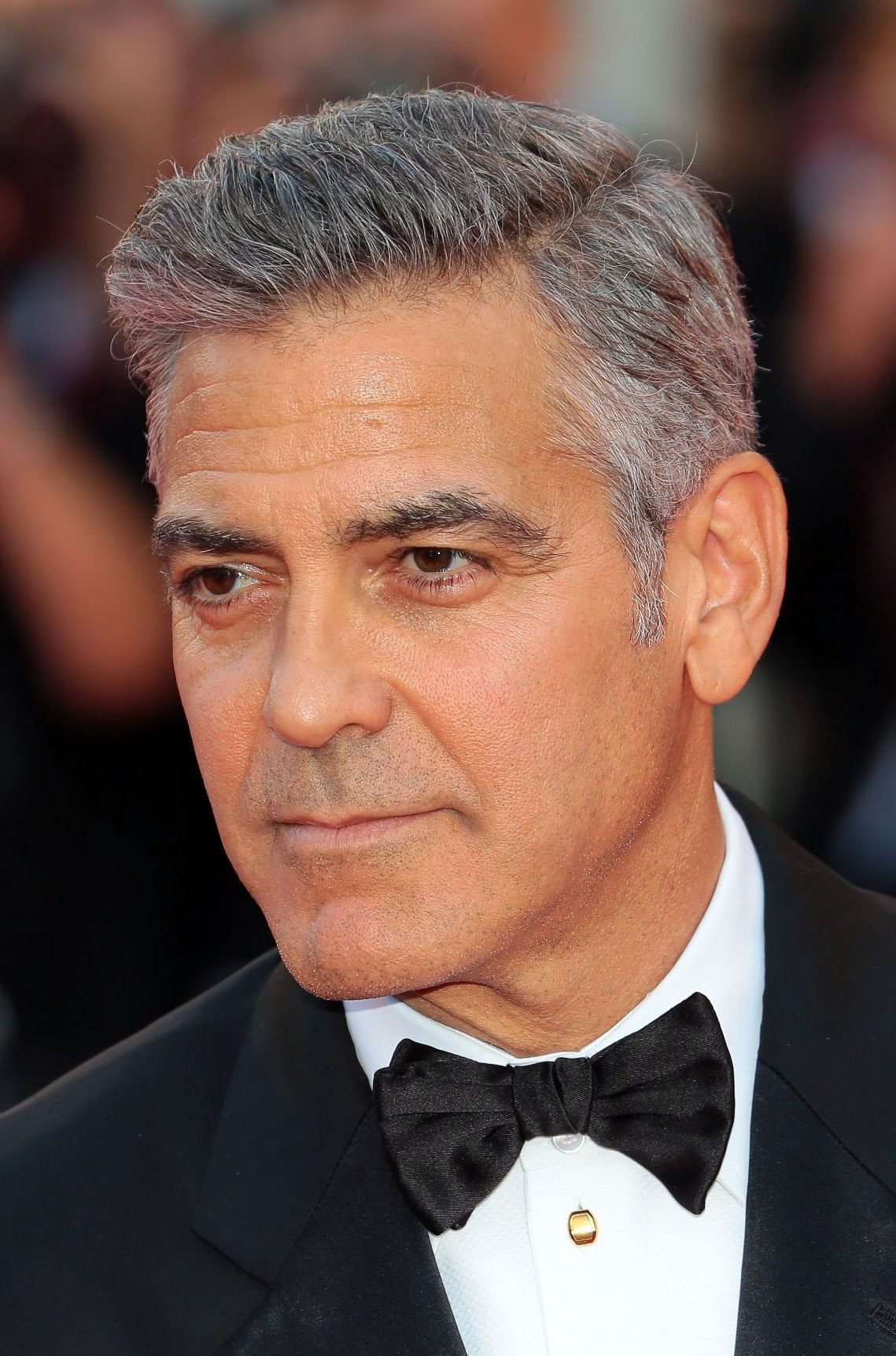 George Clooney short side part hairstyle with grey hair