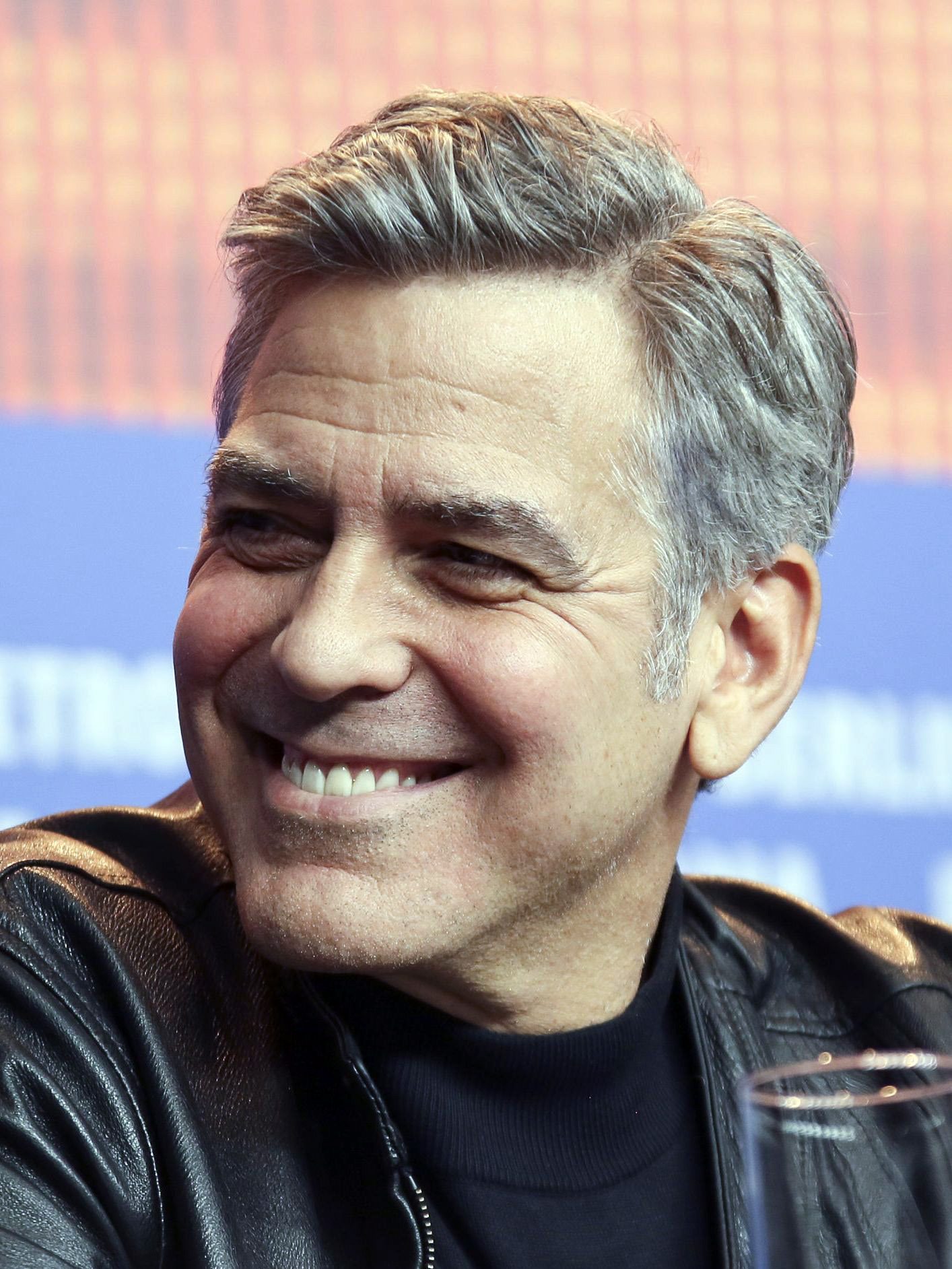 George Clooney side part hairstyle with grey hair