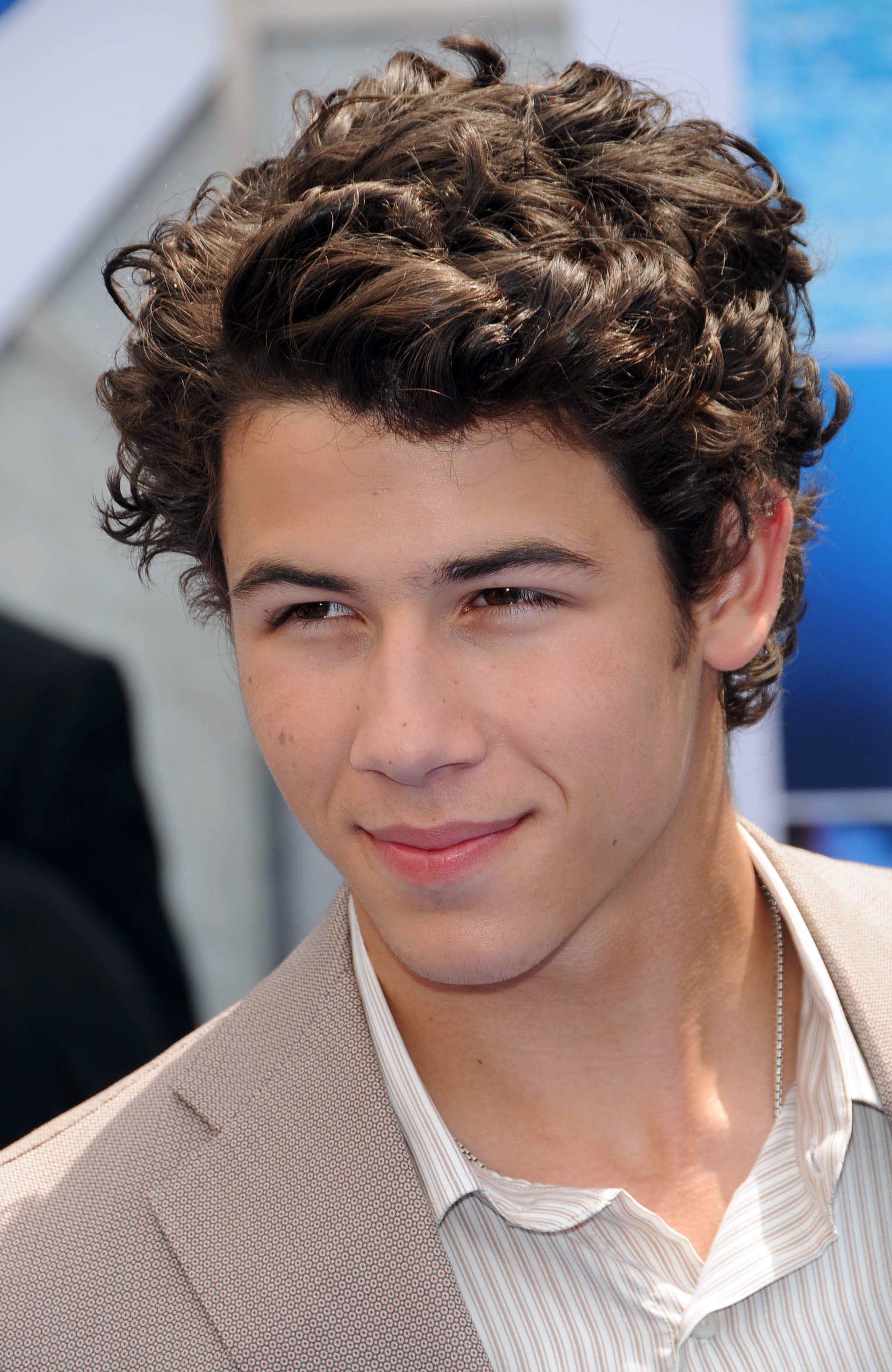 A teenage boy with long curly hair Stock Photo  Alamy