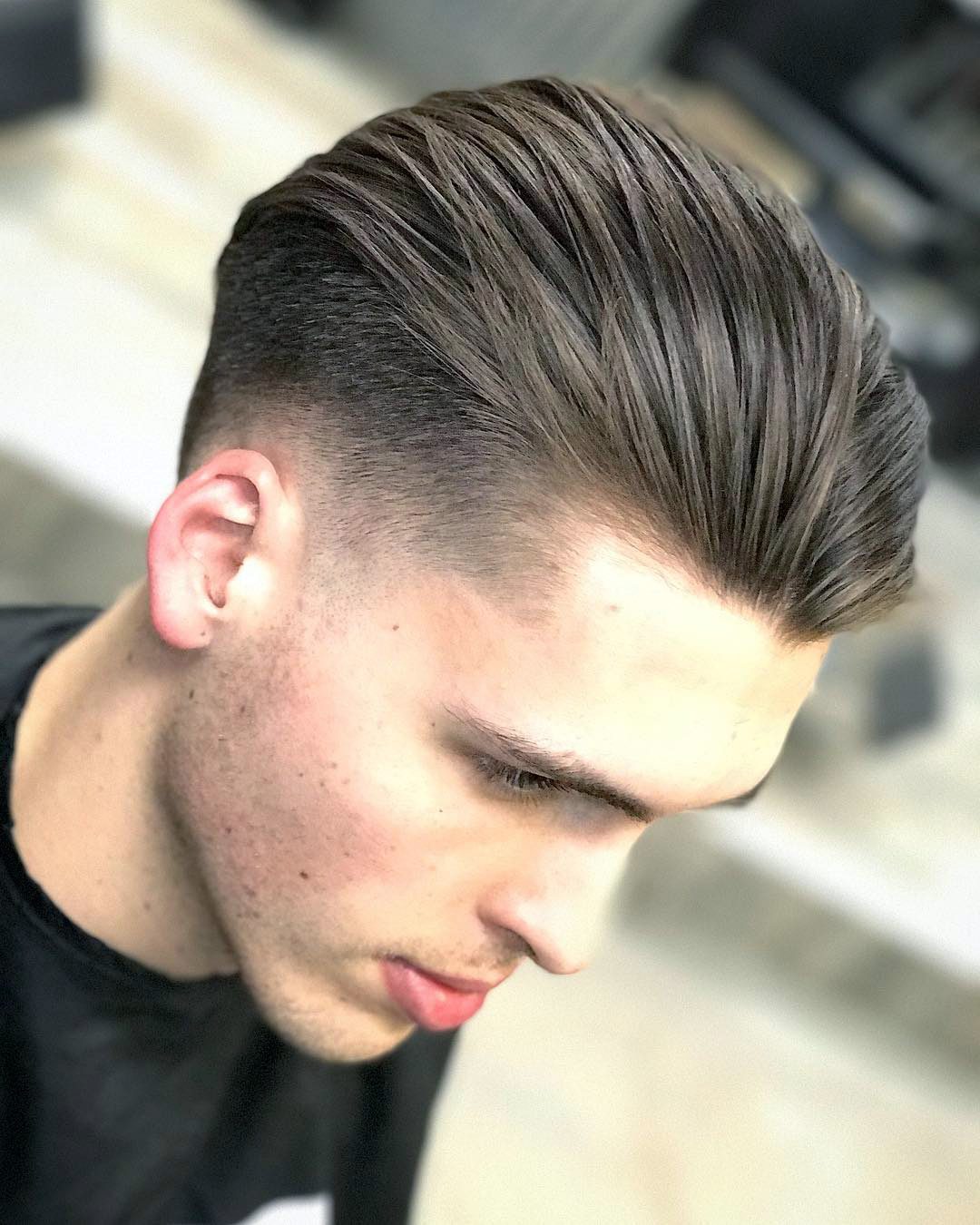 Slicked back taper fade with a line up